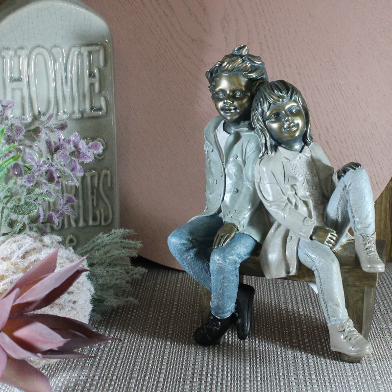 Boy & Girl sitting on bench 21cm